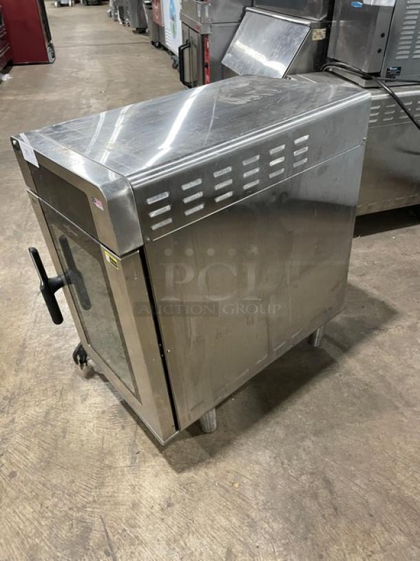 Alto-Shaam Vector-H Series high-speed oven, stainless steel, 3 cooking zones, touch controls, Model VMC-H3, on legs.