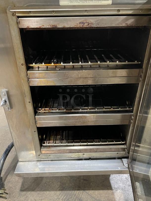 Alto-Shaam Vector-H Series 2021 stainless steel electric oven, model VMCH3. Features 3 cooking chambers with touch controls, shown open on legs.