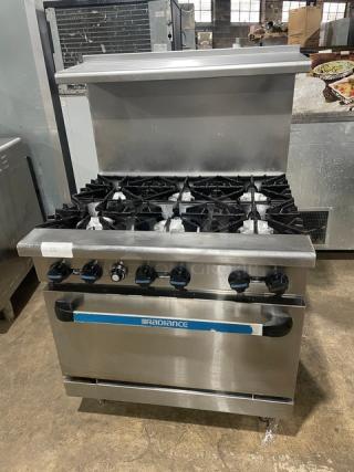 Radiance by Turbo Air commercial stainless steel 6-burner gas range/oven combo with backsplash, overhead salamander shelf, and wired oven rack.