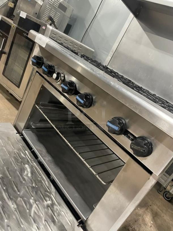 Radiance Turbo Air stainless steel 6-burner gas range/oven combo with backsplash, overhead salamander shelf, and wired oven rack.