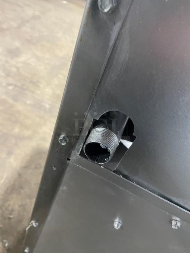 Radiance Turbo Air stainless steel gas-powered 6-burner range/oven combo. Featuring backsplash, overhead salamander shelf, and wired oven rack; mounted on sturdy legs.