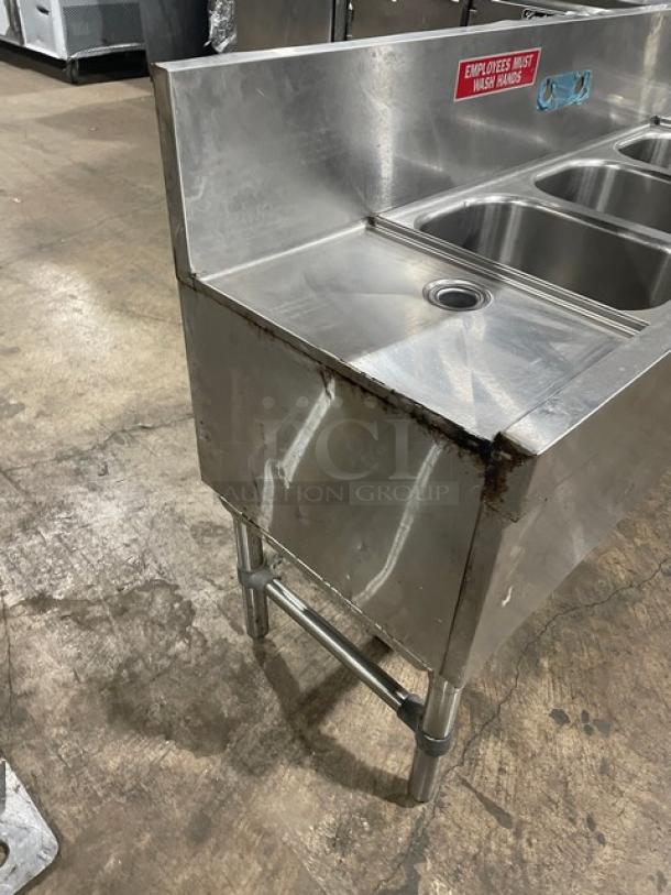 Eagle Group 60" stainless steel 3-compartment underbar sink, model B53LR19, with side drain boards, on legs. Visible label reads "Employees Must Wash Hands."