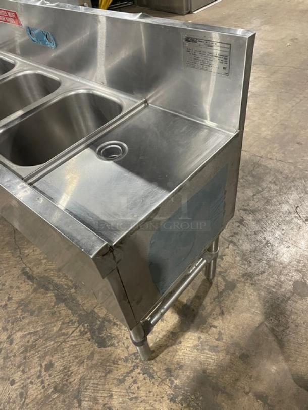 Eagle Group Spec-Bar 2000 Series stainless steel 60" 3-compartment underbar sink, model B53LR19, with side drain boards and backsplash.