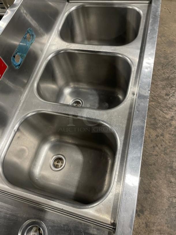 Eagle Group Spec-Bar 2000 60" stainless steel 3-compartment underbar sink, model B53LR19, with side drain boards and backsplash.