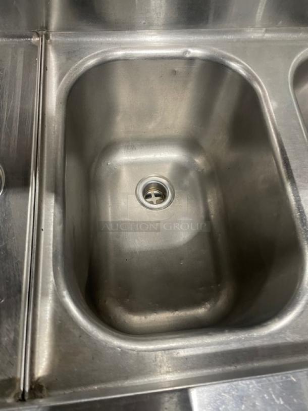 Eagle Group 60" 3-compartment stainless steel underbar sink with left and right drain boards, model B53LR19, on legs.