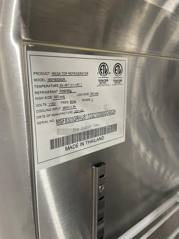 Atosa 2021 commercial stainless steel prep table, model MSF8305GR. Includes poly-coated rack, 115V, on casters. Label visible.