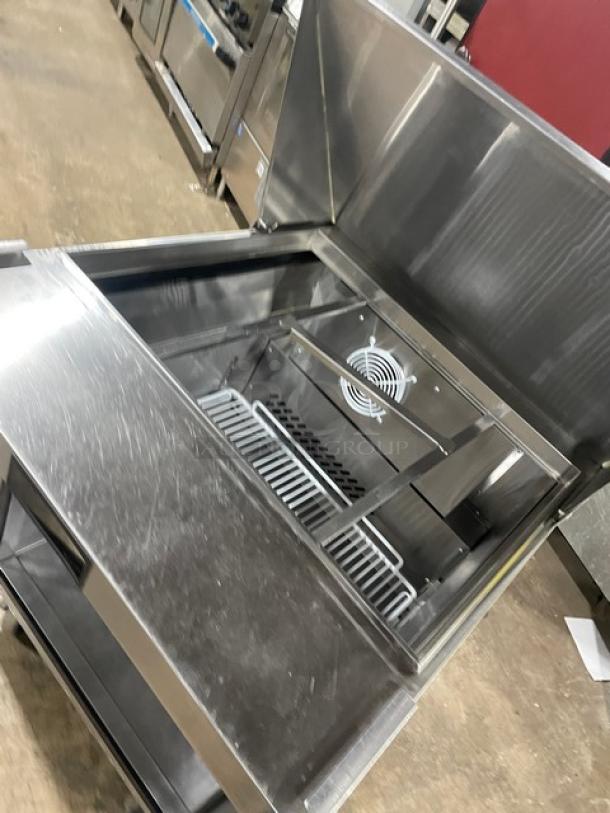 2021 Atosa MSF8305GR stainless steel refrigerated prep table, bain marie style, with poly coated rack and casters.