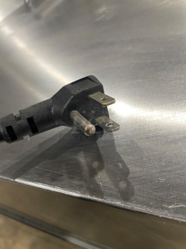 Atosa single-door refrigerated prep table plug on stainless steel surface, model MSF8305GR, 115V, 2021.