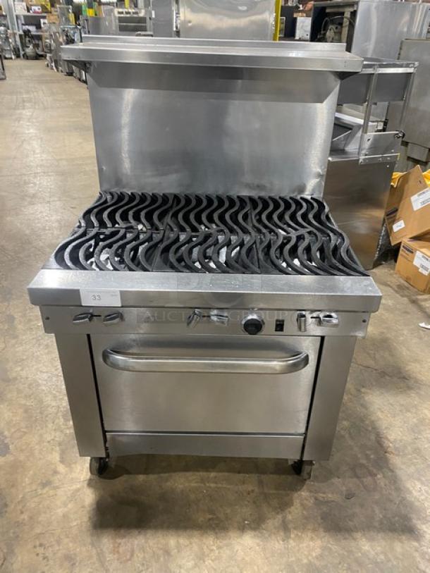 Southbend S36D stainless steel natural gas 6-burner range/oven combo, wavy grates, backsplash, salamander shelf, oven rack, on casters.