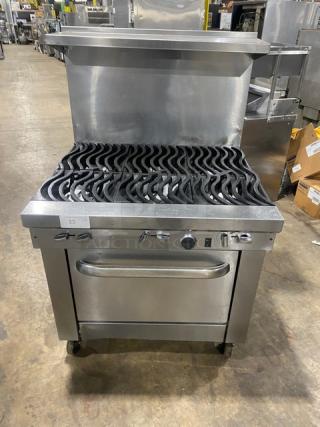 Southbend S36D stainless steel natural gas 6-burner range/oven combo, wavy grates, backsplash, salamander shelf, oven rack, on casters.