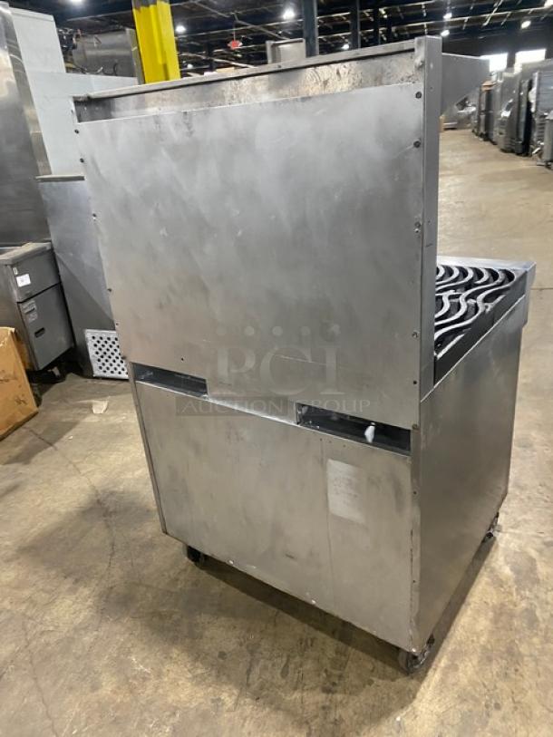 Southbend S36D commercial stainless steel 6-burner range/oven with wavy grates, backsplash, overhead salamander shelf, and wired oven rack.