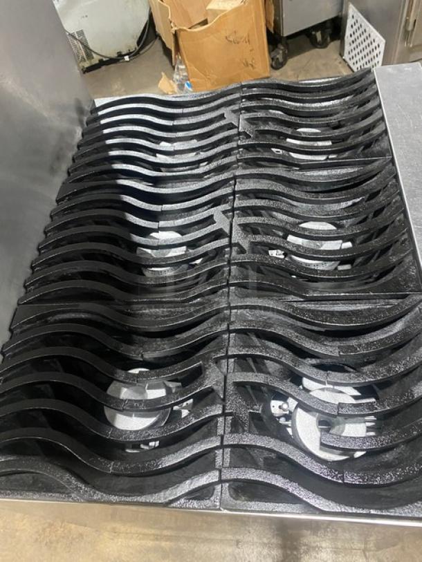 Southbend S36D commercial 6-burner range/oven with wavy non-clog grates, stainless steel, natural gas, and salamander shelf.