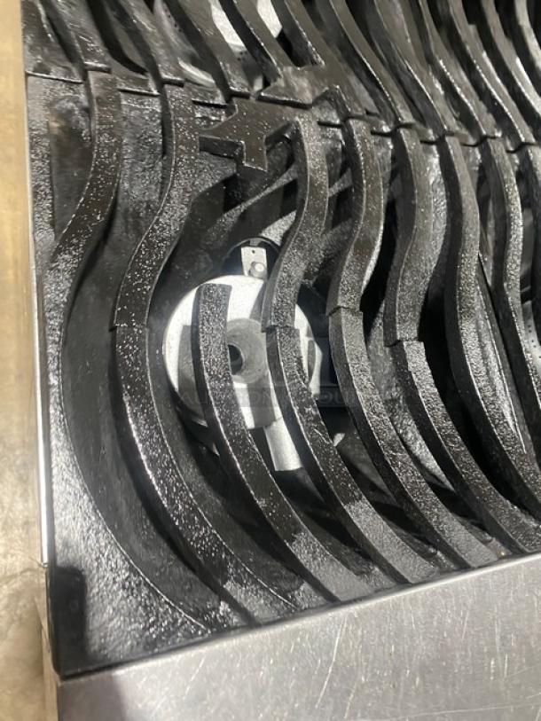 Southbend S36D commercial stainless steel range/oven with non-clog wavy grates, shown in close-up of burners.