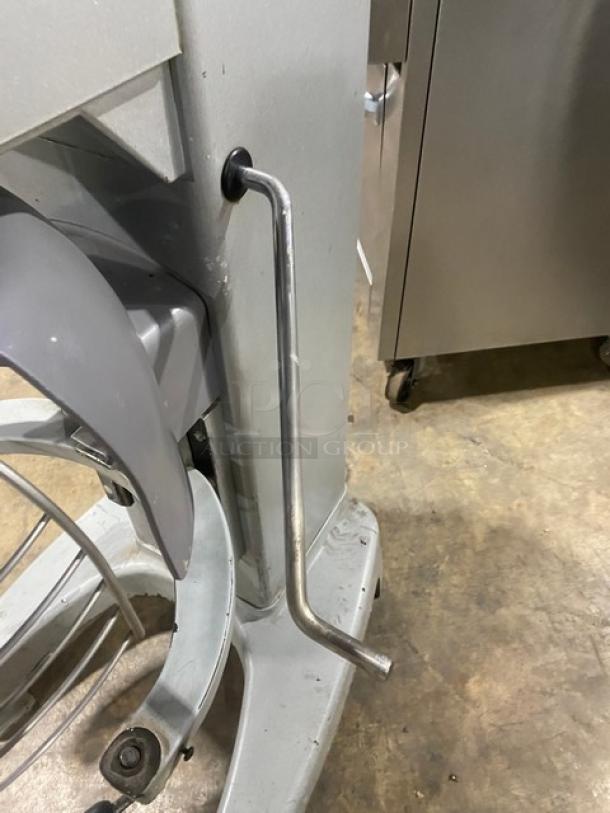 Hobart Legacy HL300 30 Qt. planetary mixer, stainless steel bowl guard, on legs, visible wear, electric powered.