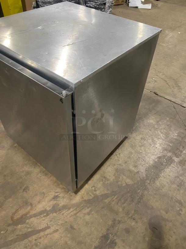 Delfield Enodis Series 27" stainless steel undercounter refrigerator, model 406CADD1, on casters, with solid door.