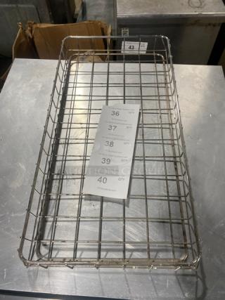 Commercial chrome-plated full-size bagel/pastry wired rack in good condition, features sturdy grid design and item tag.