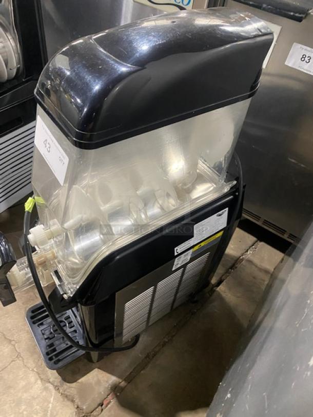 Vollrath Stoelting CBE117 commercial frozen beverage machine with 3.2 gal. clear hopper and drip tray. Black, electric.