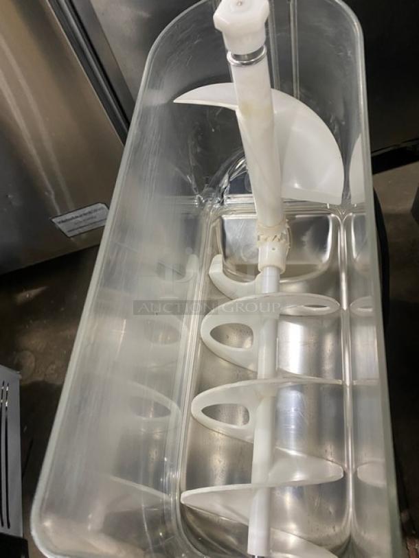 Vollrath Stoelting black countertop slushy machine, model CBE117, with 3.2 gal. clear polycarbonate hopper and drip tray.