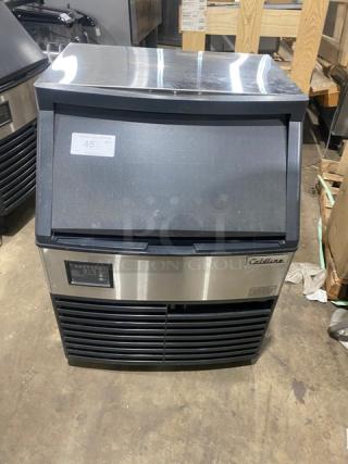 Coldline ICE180 commercial stainless steel undercounter ice maker, electric-powered, air-cooled, 115V, on legs, in good condition.