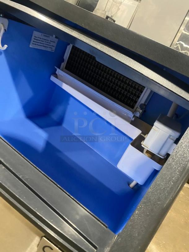 Coldline ICE180 undercounter ice machine, stainless steel, electric, air-cooled, 115V, integrated bin, on legs.