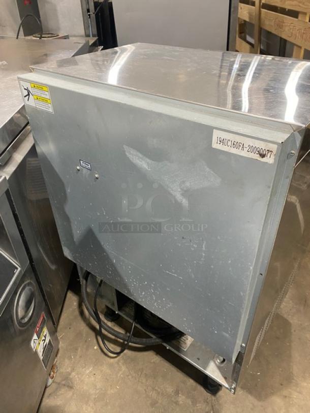 Avantco 194UC160FA stainless steel ice machine, air-cooled, electric, with serial number 194UC160FA-20090077, on legs.