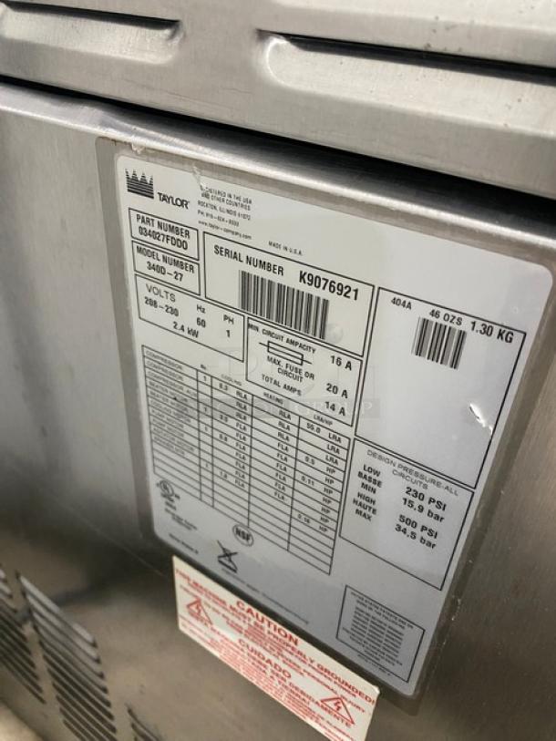Taylor 340D-27 stainless steel frozen beverage machine, single hopper, 208-230V, 1 phase, SN: K9076921, label shown.