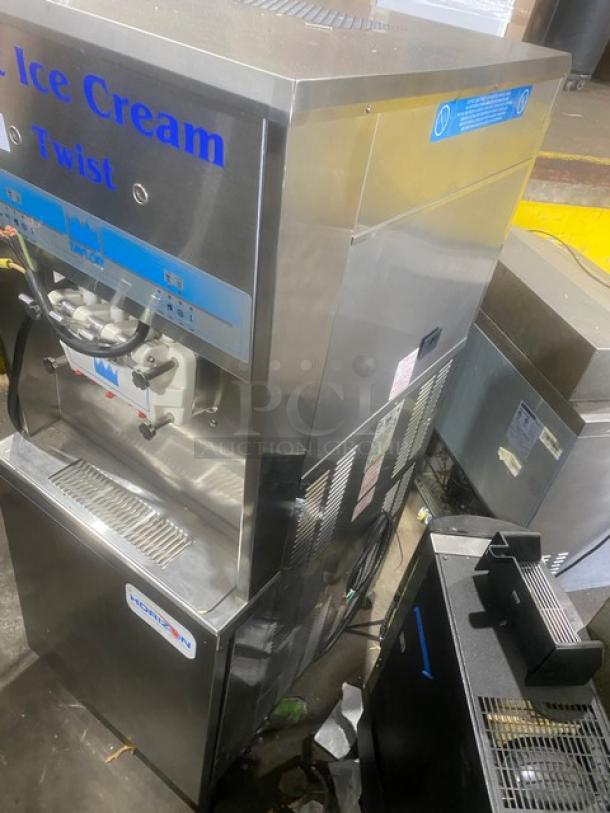 Taylor 8756P-27 commercial soft serve machine, stainless steel, 3 dispensers, drip tray, Horizon Pump System, on casters.