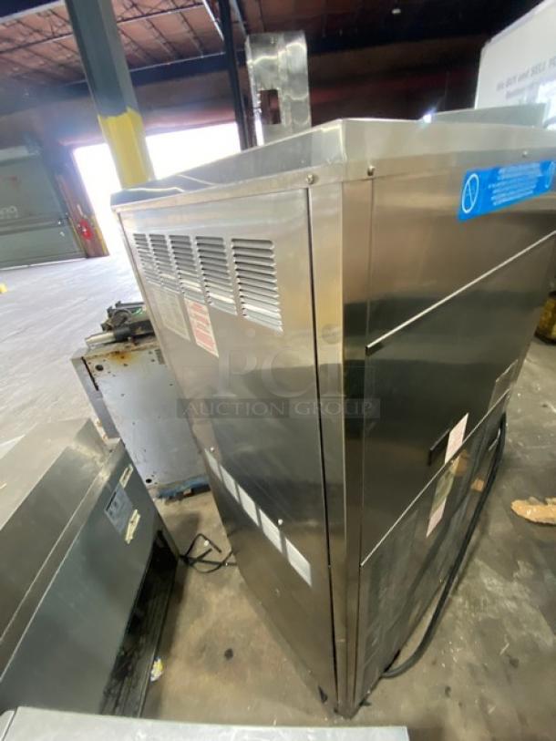 Taylor Commercial Stainless Steel Soft Serve Machine, Model 8756P-27, with 3 dispensers, drip tray, Horizon Pump, on casters.