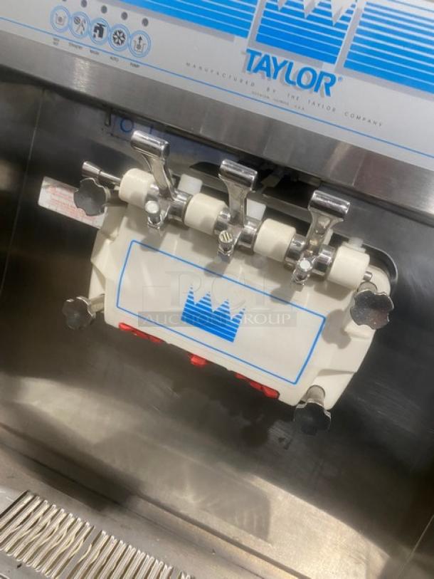 Taylor Model 8756P27 stainless steel soft serve machine with 3 dispensers, Horizon Pump System, drip tray, on casters.