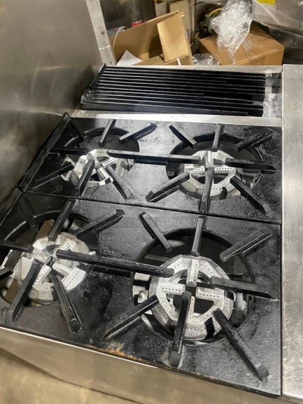 Jade Range commercial stainless steel 4-burner char broiler range/oven combo on casters, with back splash and wired oven rack.