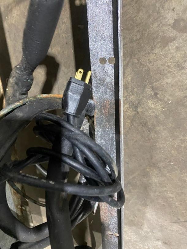 Coiled power cord for Continental Model SW72-30M prep table, 115V, 1 phase, with visible rust on metal surface.