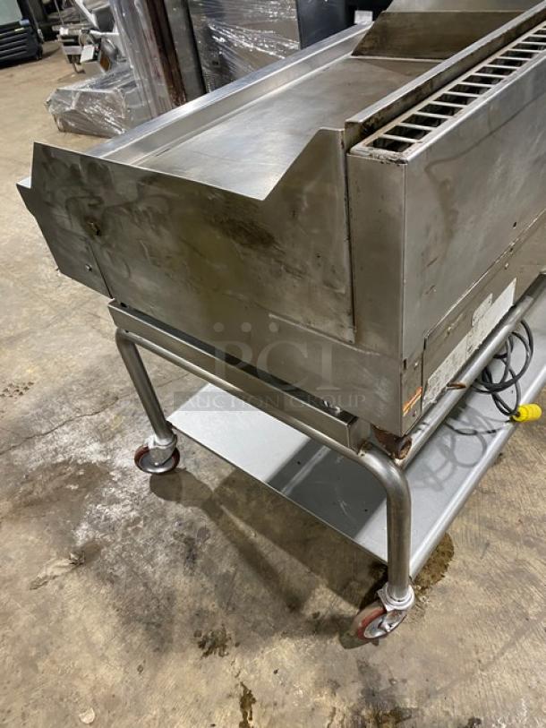 WoodStone 48" stainless steel gas griddle with back and side splash. Includes undershelf stand, casters, Model WSPL48364CT00NG.