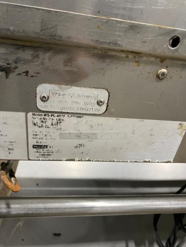 WoodStone Commercial Stainless Steel Plancha Griddle, Model WSPL48364CT00NG, visible tags with serial number showing detail.