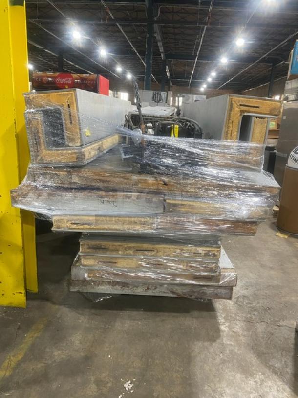 Commercial 7'x7' walk-in cooler with 2-fan evaporator and Tecumseh condensing unit, wrapped for storage.