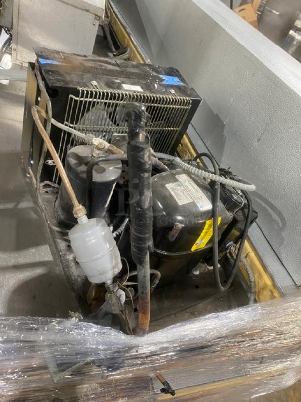 Commercial Heavy Duty 7'x7' walk-in cooler with 2-fan evaporator blower and Tecumseh condensing unit. Visible wear on components.