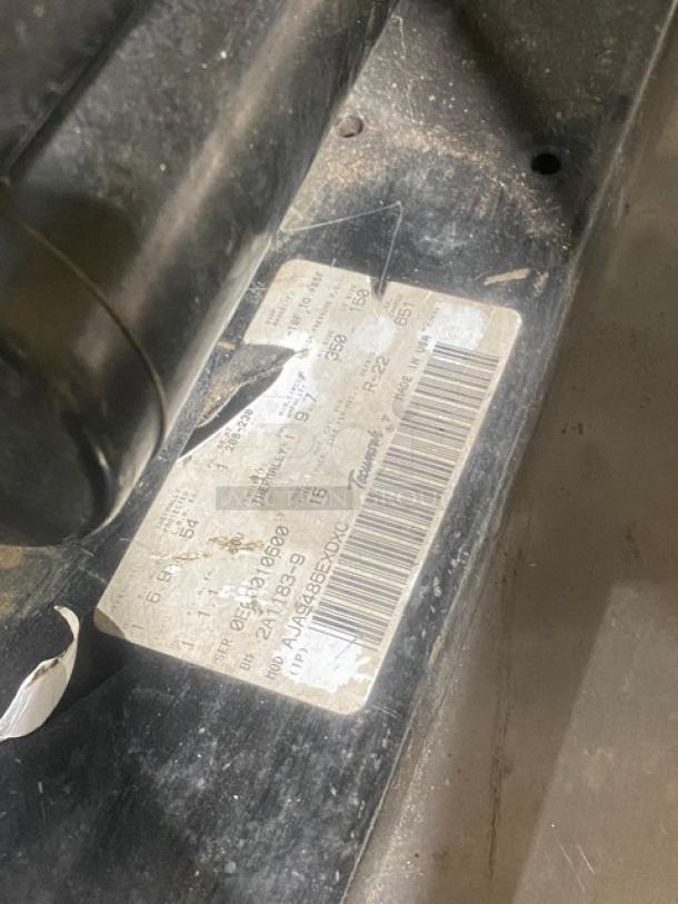 Commercial heavy-duty 7'x7' walk-in cooler box with 2-fan evaporator blower and Tecumseh condensing unit label showing specifications.