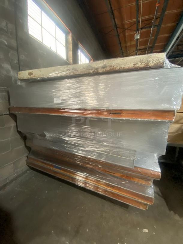 Commercial heavy-duty 5'x9' walk-in cooler box, stacked panels, includes Copeland condensing unit, used condition.