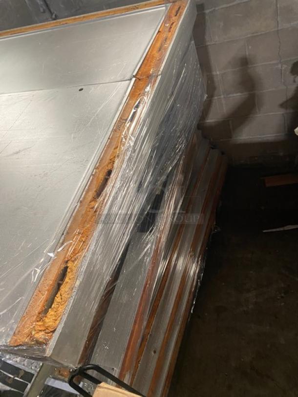 Commercial heavy duty 5'x9' walk-in cooler box with Copeland condensing unit. Appears to be partially assembled, moderate wear visible.