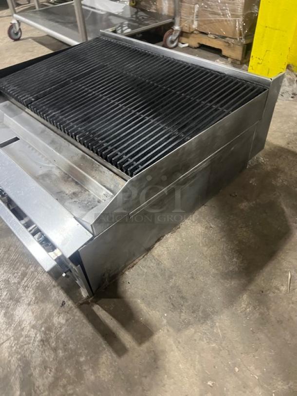 Commercial stainless steel gas-powered countertop char broiler in used condition. Durable construction, ideal for grilling.