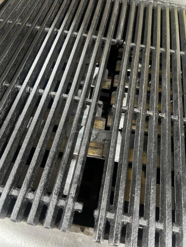 Commercial stainless steel gas countertop char broiler with grill grates. Clean, used condition, ideal for restaurants.