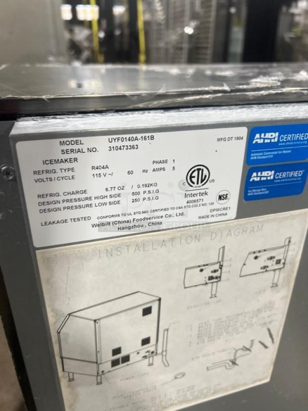 Manitowoc NEO Series UYF0140A-161B ice machine, stainless steel, air-cooled, undercounter, 115V, 1 phase, model tag visible.