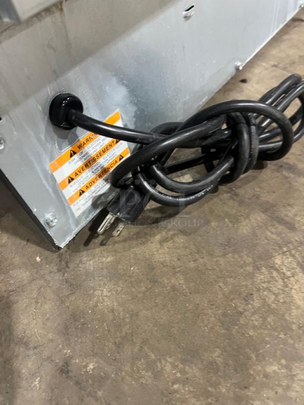 Manitowoc NEO Series ice machine Model UYF0140A-161B, stainless steel, electric, air-cooled, with warning label and power cord.