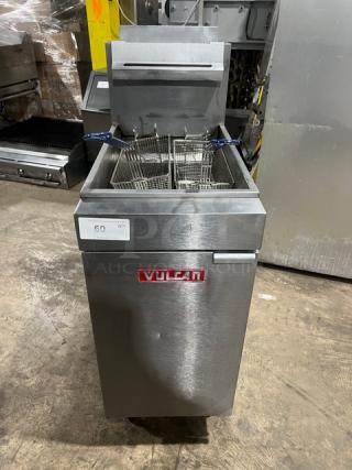 Vulcan Model LG400 commercial stainless steel deep fat fryer, 50 lb. capacity, natural gas powered, with backsplash, basket hanger, and fry basket, on casters. Serial: DV-1070061HB.