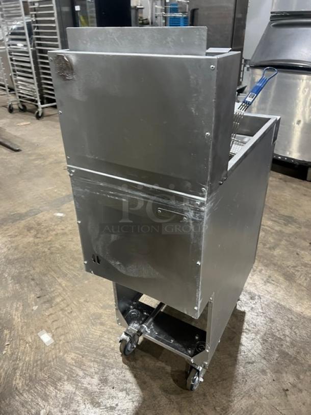 Vulcan LG400 stainless steel deep fat fryer, natural gas-powered, 50 lb. capacity with backsplash, basket hanger, and casters.