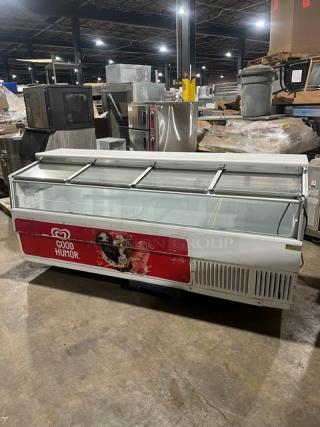 Hussmann LBN8 ice cream display freezer, Good Humor branding, 96" wide, 4 glass sliding doors, 115V, used condition.