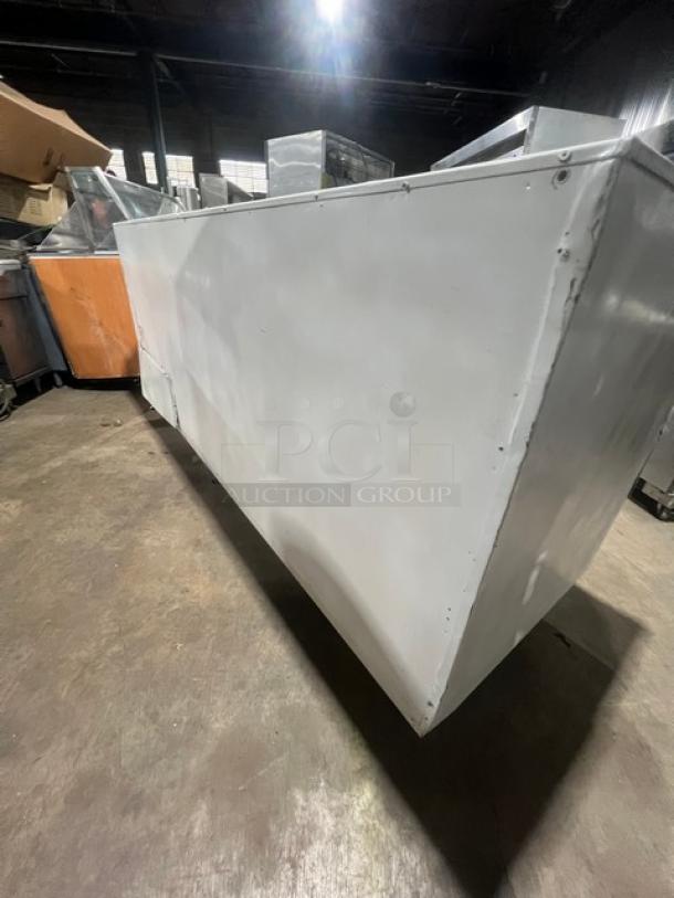 Hussmann LBN8 commercial white freezer, 96" with four glass sliding-back doors, used condition, model SN: MY11B004683.