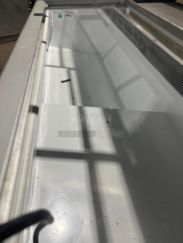 White Hussmann LBN-8 commercial freezer with 4 sliding glass doors, model LBN8, clean interior, 115V 1 Phase, serial MY11B004683.