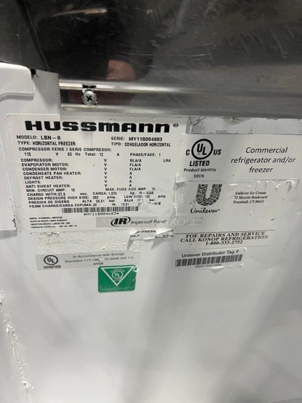Hussmann LBN-8 commercial freezer label, showing model, SN: MY11B004683, UL-listed, 115V, for ice cream/frozen food storage.