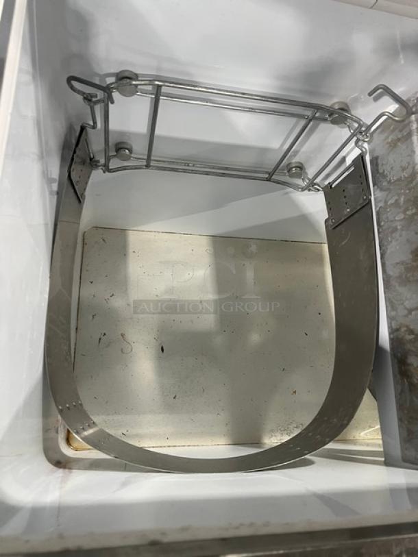 Beverage-Air BRT-68P 68" dipping cabinet interior with rack. White enamel finish, visible wear, sneeze guard included.