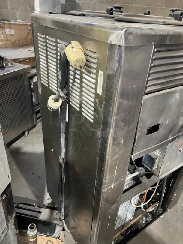 Taylor Model 63233 commercial stainless steel dual shake and soft serve freezer, spinner head mixer, on casters, 208/230V 3 phase.